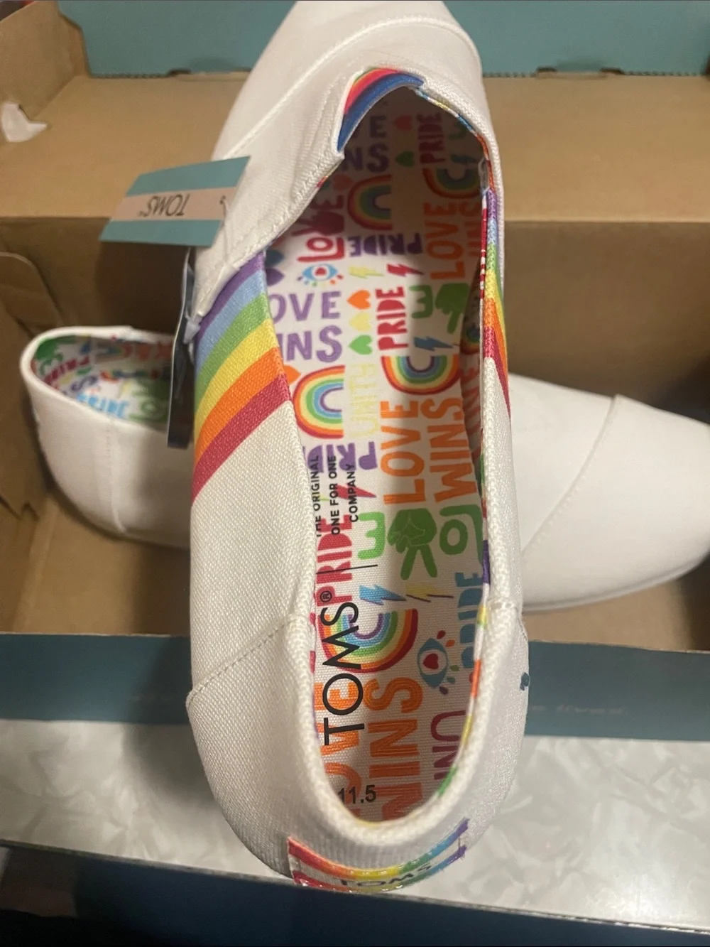 TOMS White Canvas Slip-Ons with Rainbow Stripes
